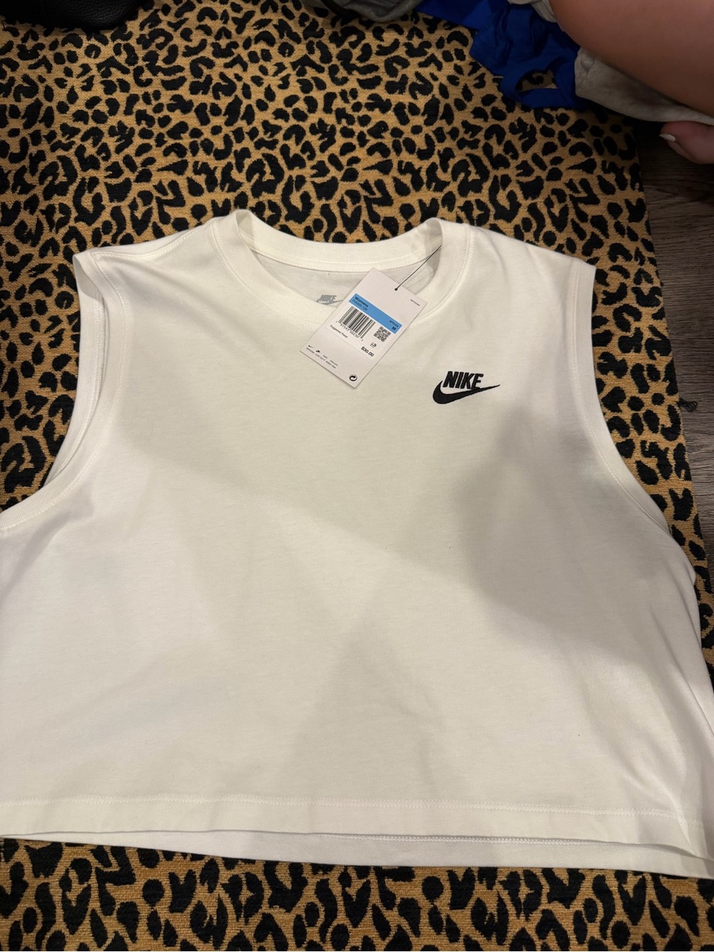 Nike White Sleeveless Cropped Tank with Black Swoosh Logo